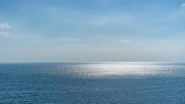 Seascape with a view of the blue sea and the sky.