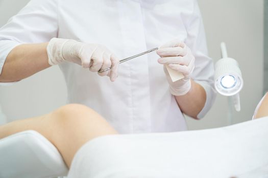 Young woman patient with a gynecologist during the consultation in the gynecological office