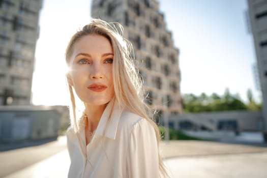 Close up portrait of young blonde businesswoman outdoors