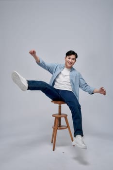 man sitting on a bar stool