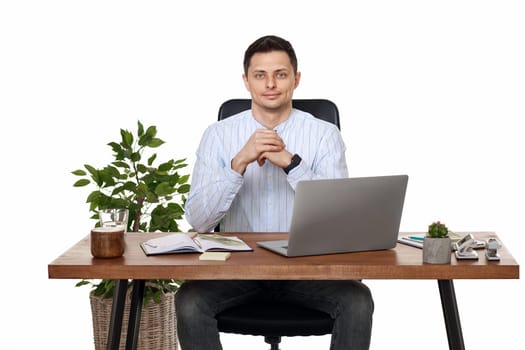 positive entrepreneur man using laptop computer for online work at table on white background