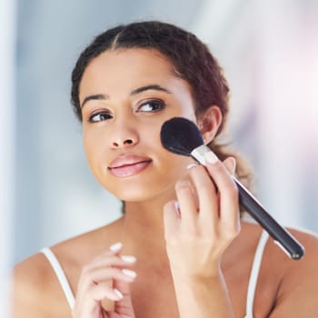 Beauty, self care and woman with a makeup brush for a natural, skin and face in her bathroom. Cosmetic, glamour and beautiful female person with cosmetics powder for morning routine in her apartment