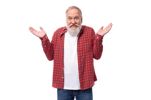 handsome 60s retired man with white beard and mustache throws up his hands.