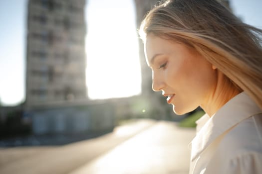 Close up portrait of young blonde businesswoman outdoors