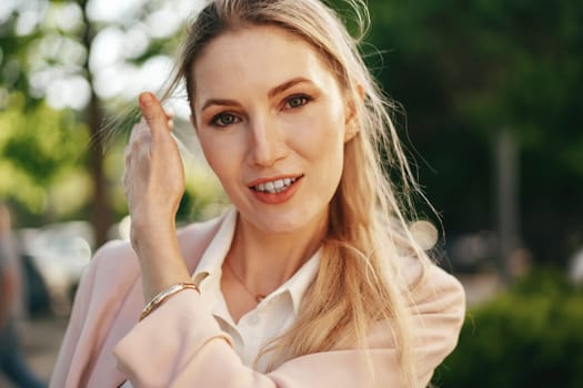 Close up portrait of young blonde businesswoman outdoors