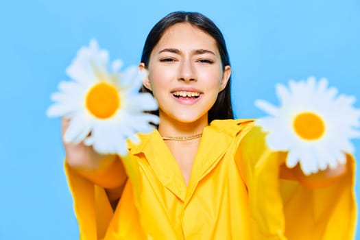 woman concept person happiness beautiful summer pretty flower young face attractive blue model romantic portrait spring trend chamomile yellow caucasian smile