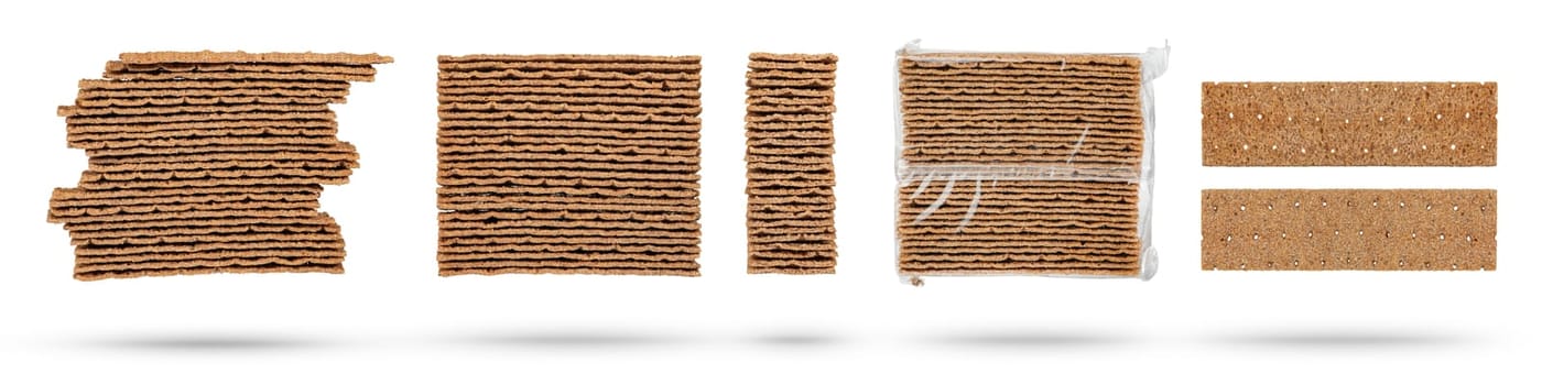 Set of different rye chips on a white background. The chips are stacked one on top of the other, close-up side view. A set of dried bread slices for sandwiches