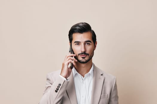 man suit internet smartphone smile corporate hold cellphone trading male cell handsome connection business isolated phone portrait entrepreneur call happy businessman