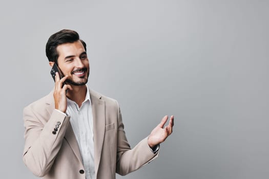 phone man hold smartphone suit space guy cell lifestyle call happy smile phone handsome confident mobile success trading corporate business beard portrait copy