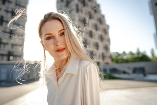 Close up portrait of young blonde businesswoman outdoors