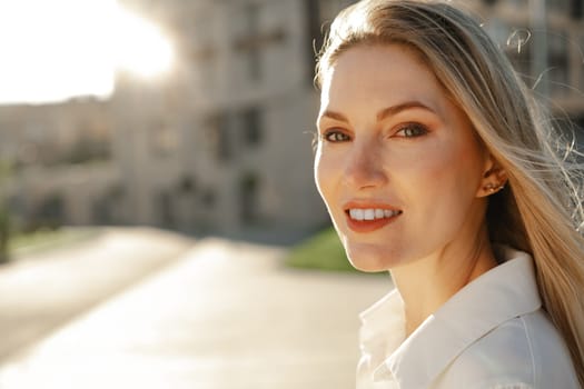 Close up portrait of young blonde businesswoman outdoors