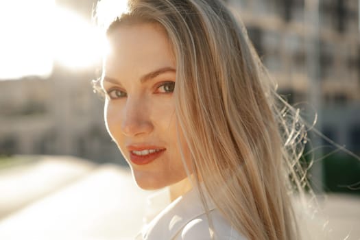 Close up portrait of young blonde businesswoman outdoors