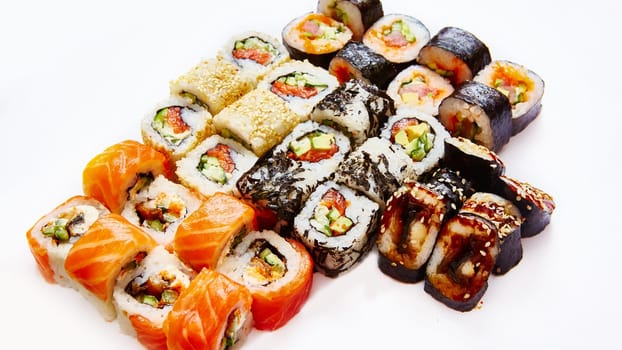 Set of sushi roll with salmon, avocado, cream cheese, cucumber, rice, tuna on white background.