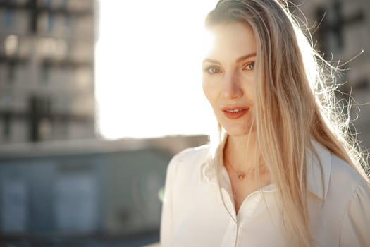 Close up portrait of young blonde businesswoman outdoors