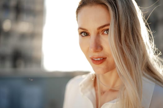 Close up portrait of young blonde businesswoman outdoors