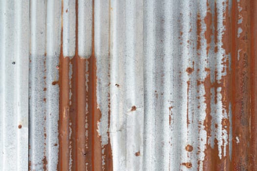 Rusty zinc sheet texture and background, Reddish brown stain on metallic silver