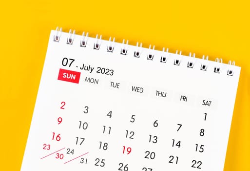 July 2023 Monthly desk calendar for 2023 year on yellow color background.