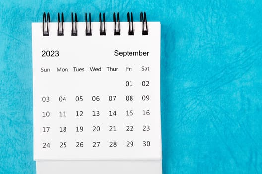 September 2023 Monthly desk calendar for 2023 year on blue background.