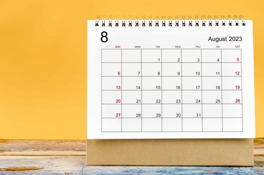 August 2023 Monthly desk calendar for 2023 year on yellow background.