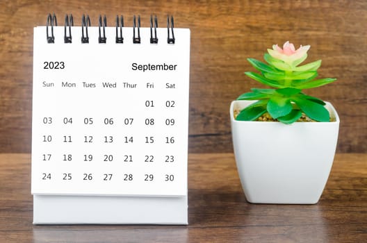 September 2023 Monthly desk calendar for 2023 year with plant pot.