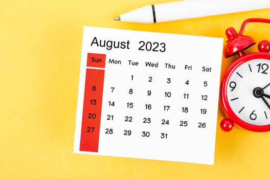 August 2023 Monthly calendar for 2023 year with alarm clock on yellow background.