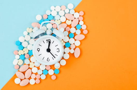 Alarm clock and many drug. Taking medicine at the right time concepts.