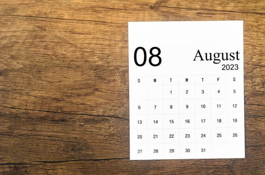 August 2023 Monthly calendar for 2023 year on wooden background.