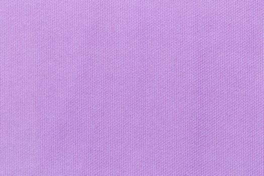 Light purple background from a textile material. Fabric with natural texture.