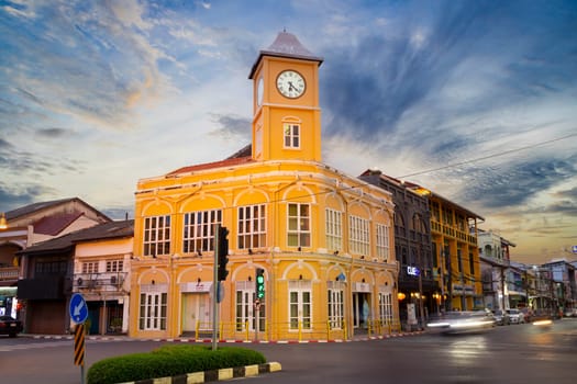 Phuket Thailand , September 14th 2020 ; Landmark chino-portuguese clock tower in phuket old town, Thailand, with light trails on road in twilight time.