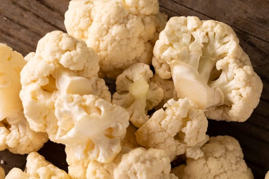 Close-up of fresh cauliflower on table. unaltered, vegetable, healthy food, raw food and organic concept.