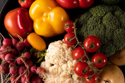 Close-up of various colorful vegetables in frying pan. unaltered, vegetable, healthy food, raw food, variation and organic concept.