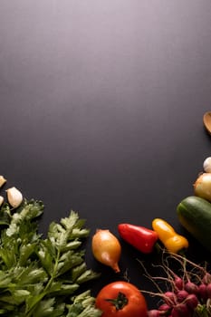Overhead view of fresh food on black background with copy space. unaltered, food, studio shot, healthy eating, organic.