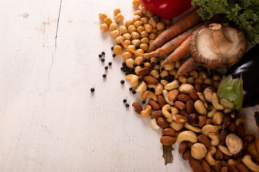 High angle view of various healthy food and ingredients on white table, copy space. unaltered, food, preparation, healthy eating.