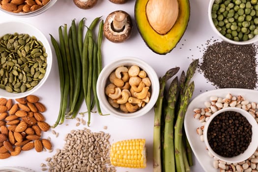 Directly above view of healthy food and ingredients arranged on white table, copy space. unaltered, food, preparation, healthy eating.