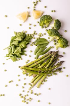 Directly above view of fresh vegetables and fruit slices on white background. unaltered, food, healthy eating, organic concept.