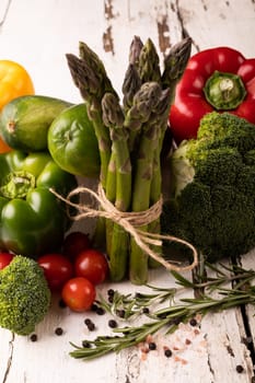 Close-up of various fresh vegetables on white wooden table. unaltered, food, healthy eating, organic concept.