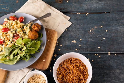 Directly above view of fresh italian meal served in bowl on wooden table. unaltered, food, healthy eating, organic concept.