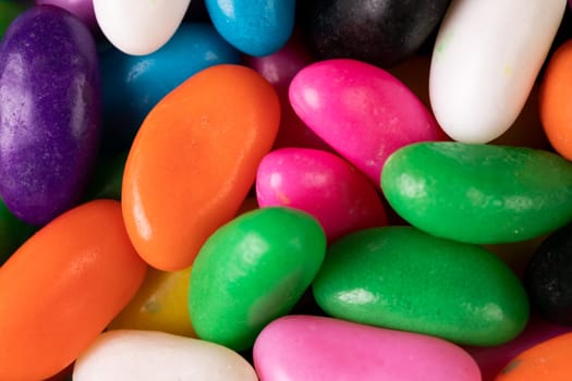 Overhead view of full frame multi colored sweet candies. unaltered, sweet food and unhealthy eating concept.