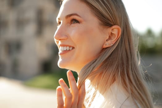 Close up portrait of young blonde businesswoman outdoors