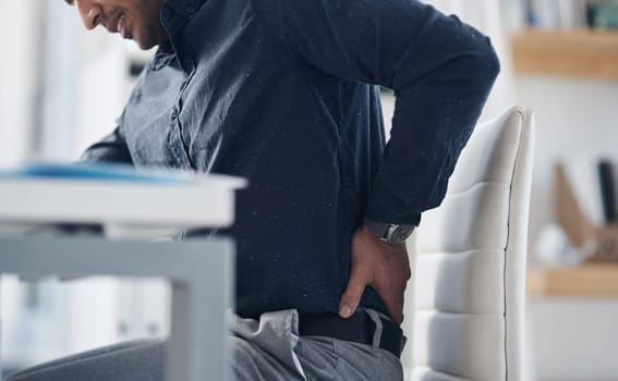 Tired, back pain and stress with business man in office for problem, frustrated and muscle fatigue. Burnout, tension and body with closeup of male employee for spine injury, accident and emergency.