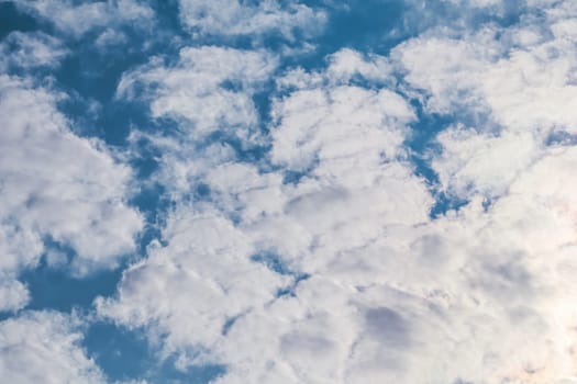 Background of blue sky with white clouds. Natural backdrop