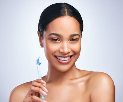 Woman, toothbrush and studio portrait with smile for self care, dental wellness or health by white background. Girl, dentistry model and toothpaste for brushing teeth, product and happy for cleaning.