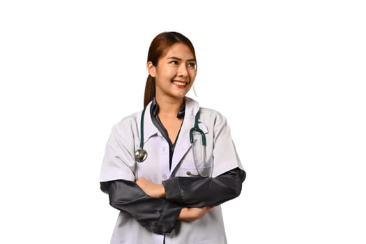 Portrait of a friendly female doctor in white coat standing isolated on white background. Medical and healthcare concept.