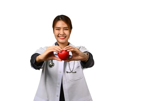 Portrait of female doctor cardiologist holding red heart isolated on white background. Cardiology, medical and healthcare concept.