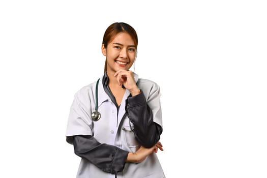 Cheerful young female doctor in white coat with stethoscope smiling at camera isolated on white background. Healthcare concept.