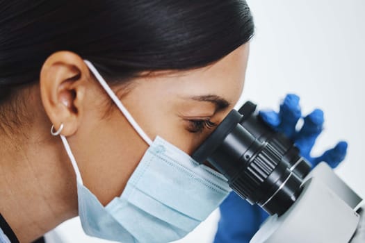 Science, laboratory and face of woman with microscope for medical analysis, research and lab test. Healthcare, biotechnology and female scientists with equipment for sample, experiment and virus.