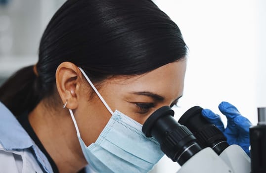 Science, laboratory and woman with microscope for research, medical analysis and lab test. Healthcare, biotechnology and female scientist with equipment for sample, experiment and exam for virus.