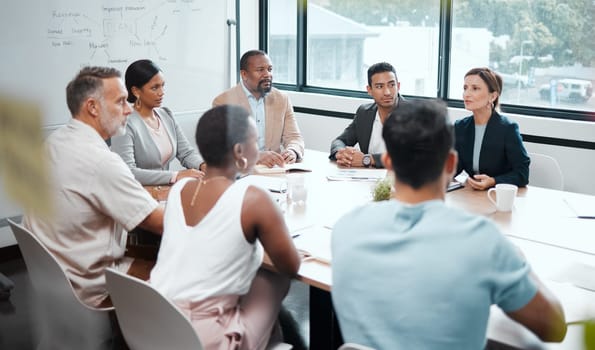 Business people, meeting and strategy in corporate planning, brainstorming or team discussion at the office. Group of employees in teamwork, collaboration or communication in conference at workplace.