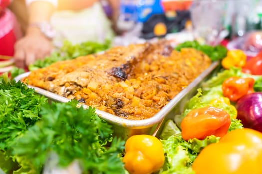 Aluminum tray with traditional Christmas food from Nicaragua known as relleno