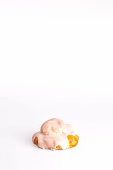 fresh bun with delicate cream on a white background.